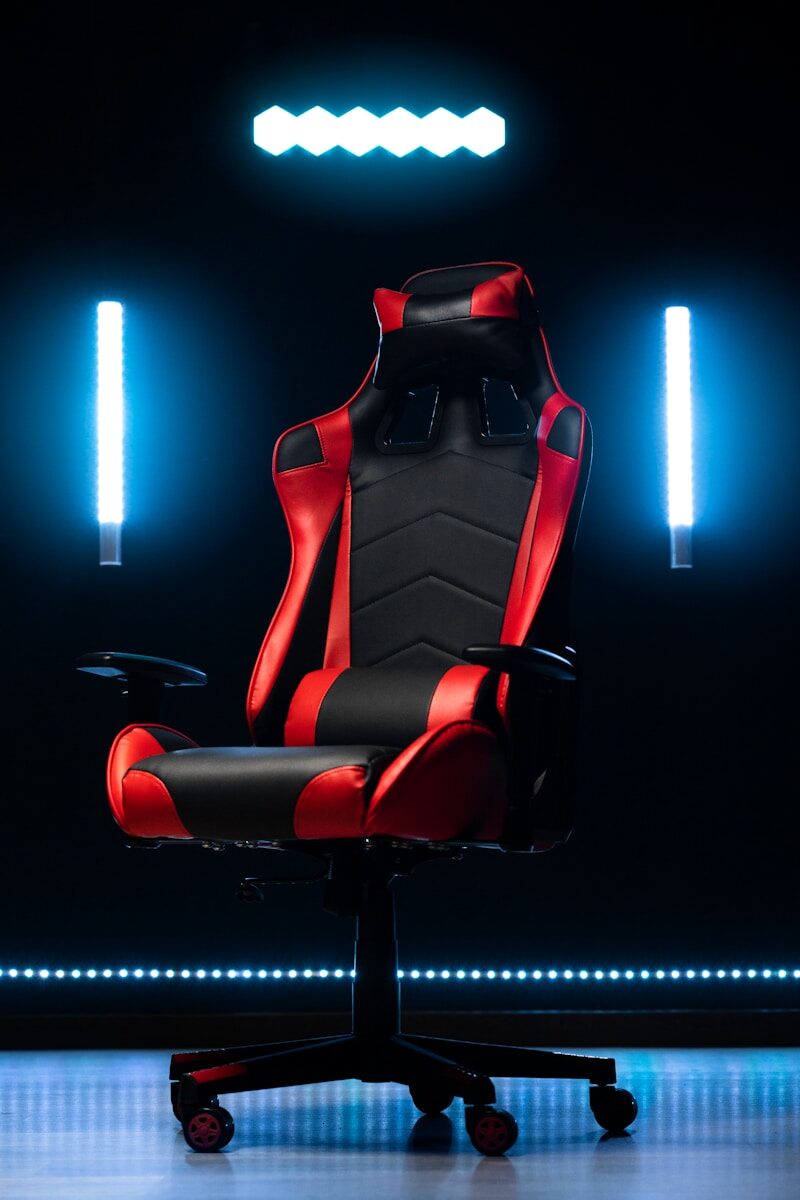 Photo by fadoul m A red and black gaming chair with blue lights