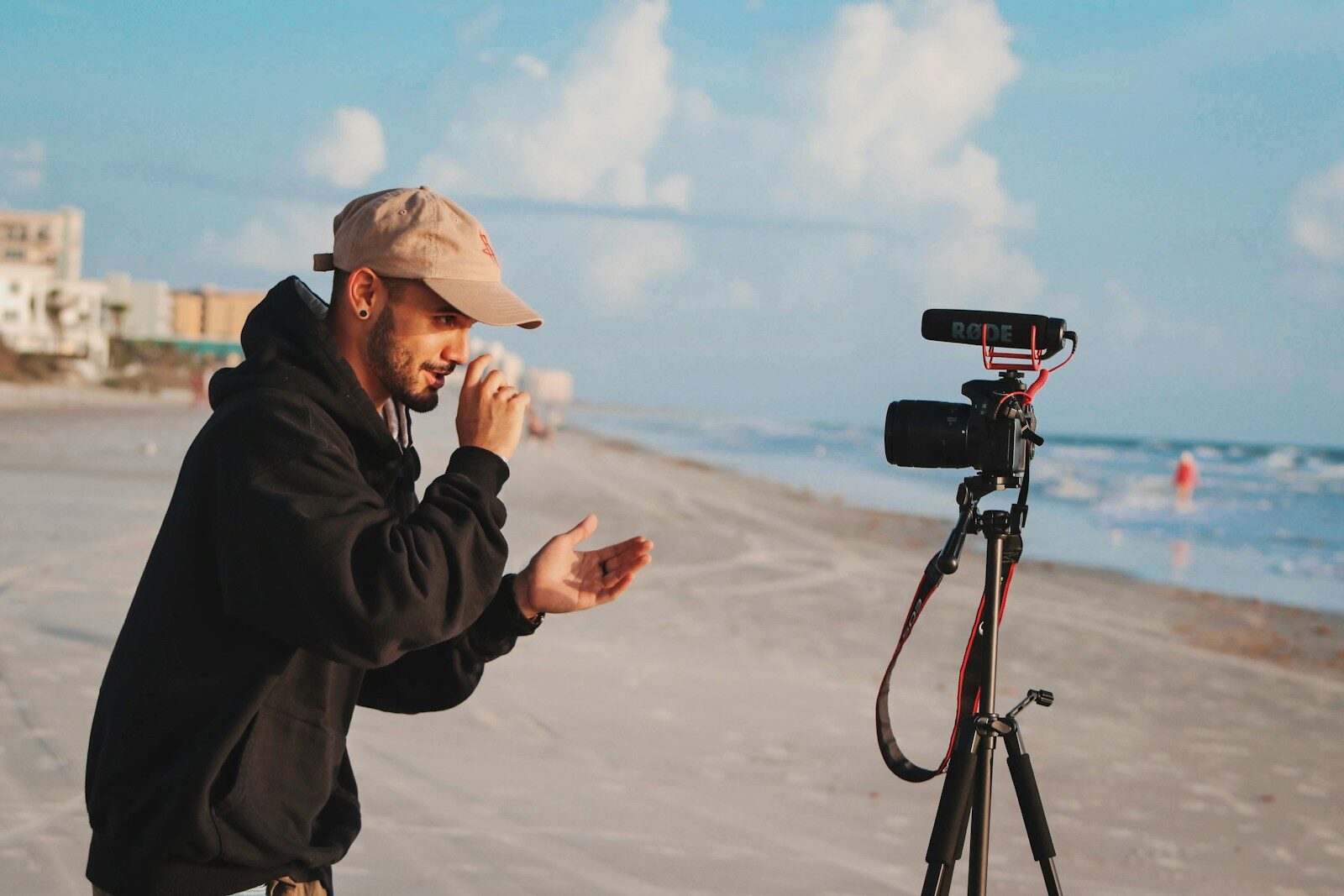 Photo by Andrés man in black jacket holding camera during daytime